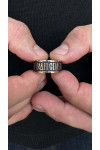 Gold heel with the prayer "Our Father"