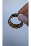 Gold heel with the prayer "Our Father"