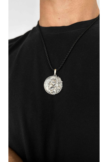 Silver amulet pendant with the image of a lion