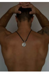 Silver amulet pendant with the image of a lion